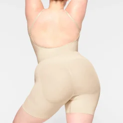 SEAMLESS SCULPT LOW BACK MID THIGH BODYSUIT | SAND