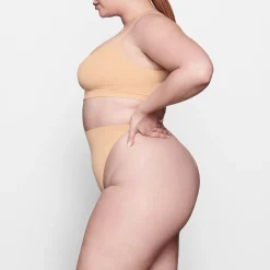 SEAMLESS SCULPT MID WAIST THONG | OCHRE