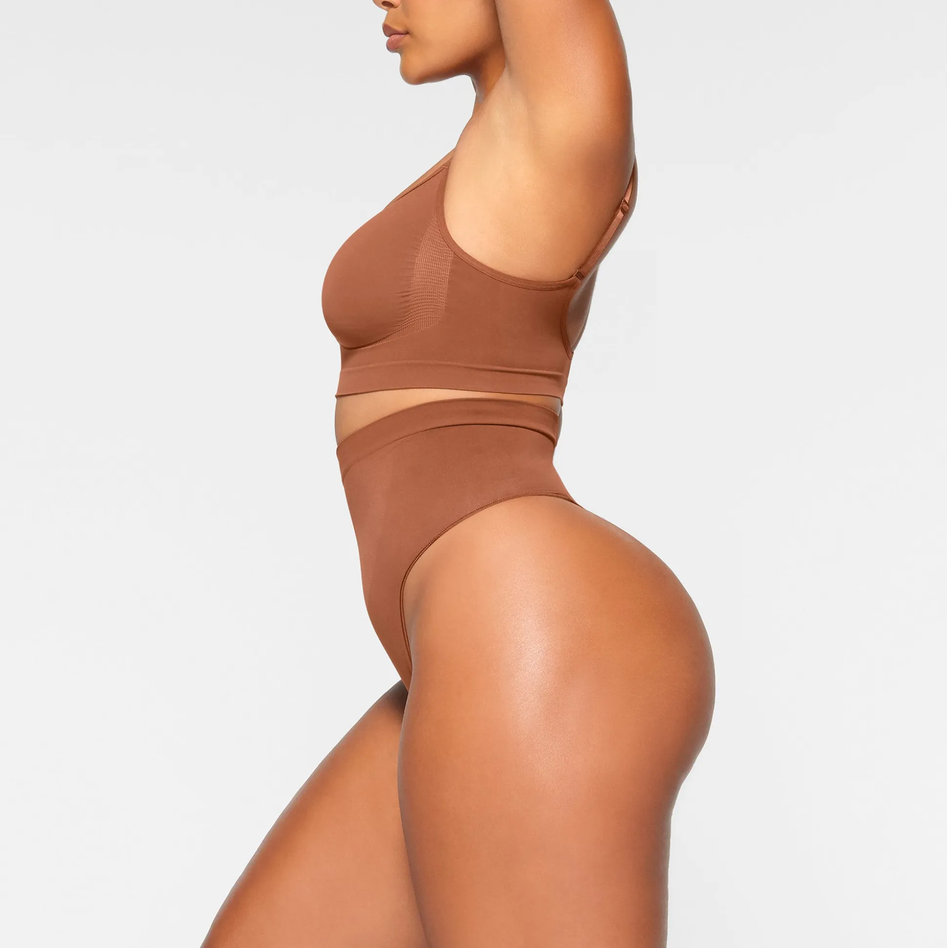 SEAMLESS SCULPT MID WAIST THONG | BRONZE