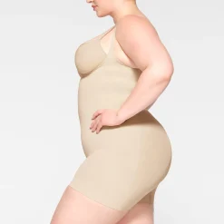 SEAMLESS SCULPT OPEN BUST SHORTIE BODYSUIT | SAND