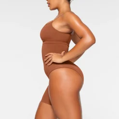 SEAMLESS SCULPT SOLUTION SHORT LEFT LEG EXPOSED | BRONZE
