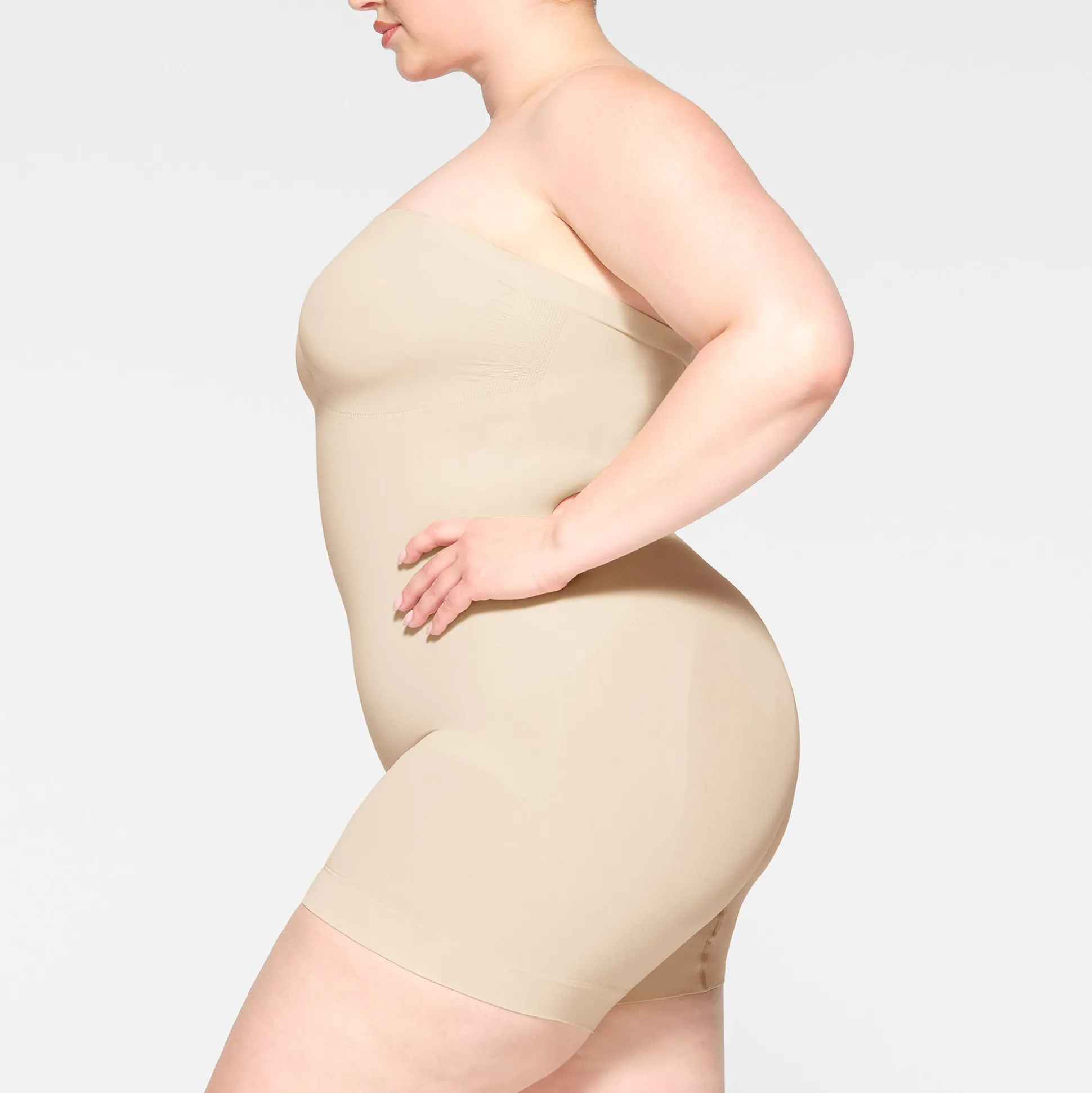SEAMLESS SCULPT STRAPLESS SHORTIE BODYSUIT | SAND
