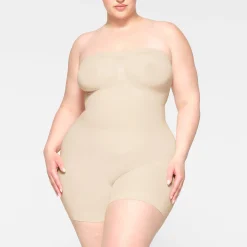 SEAMLESS SCULPT STRAPLESS SHORTIE BODYSUIT | SAND