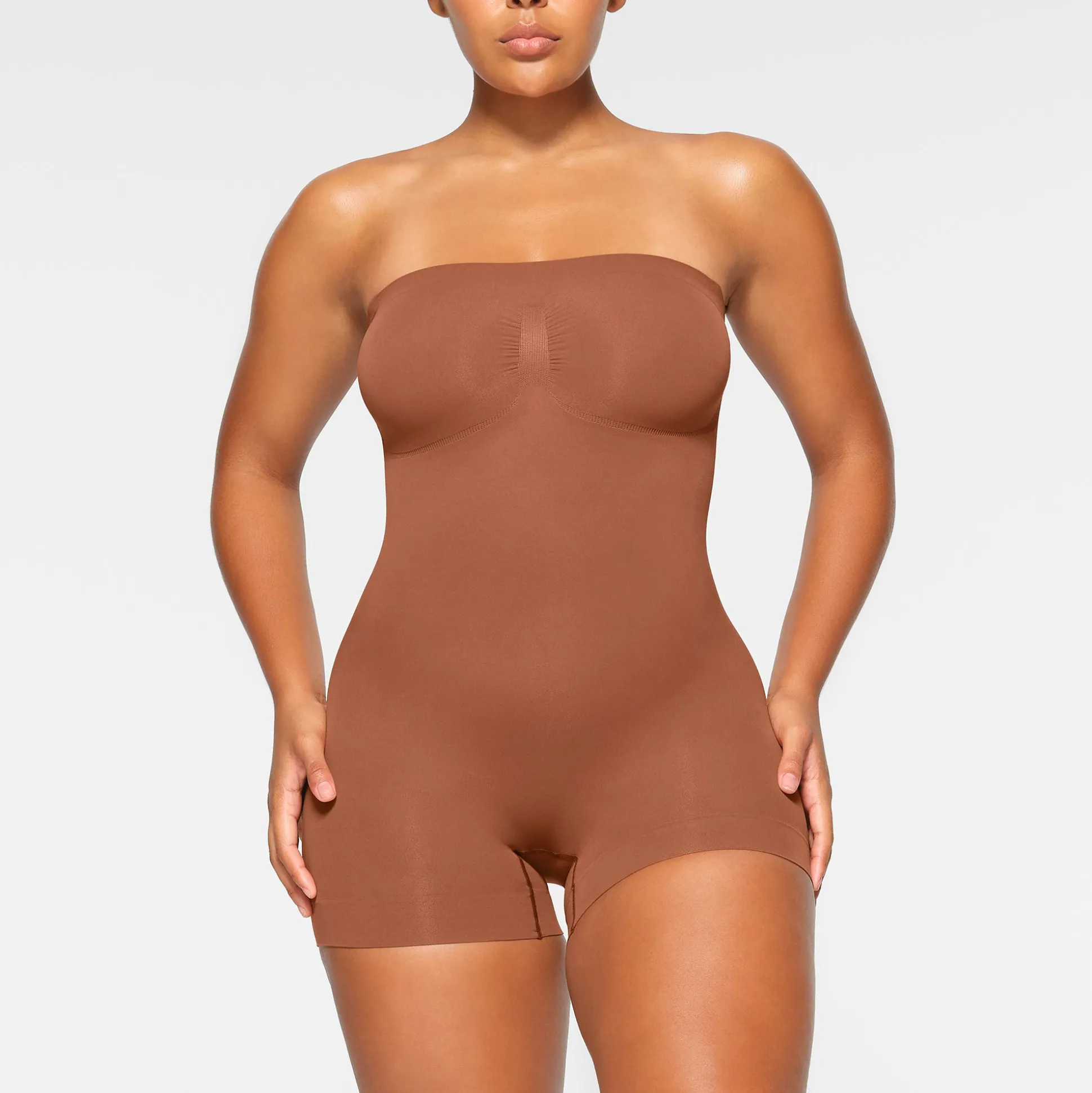 SEAMLESS SCULPT STRAPLESS SHORTIE BODYSUIT | BRONZE